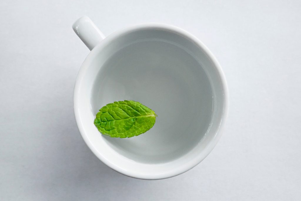 Mint tea like this cup with a mint leaf is great for digestion.