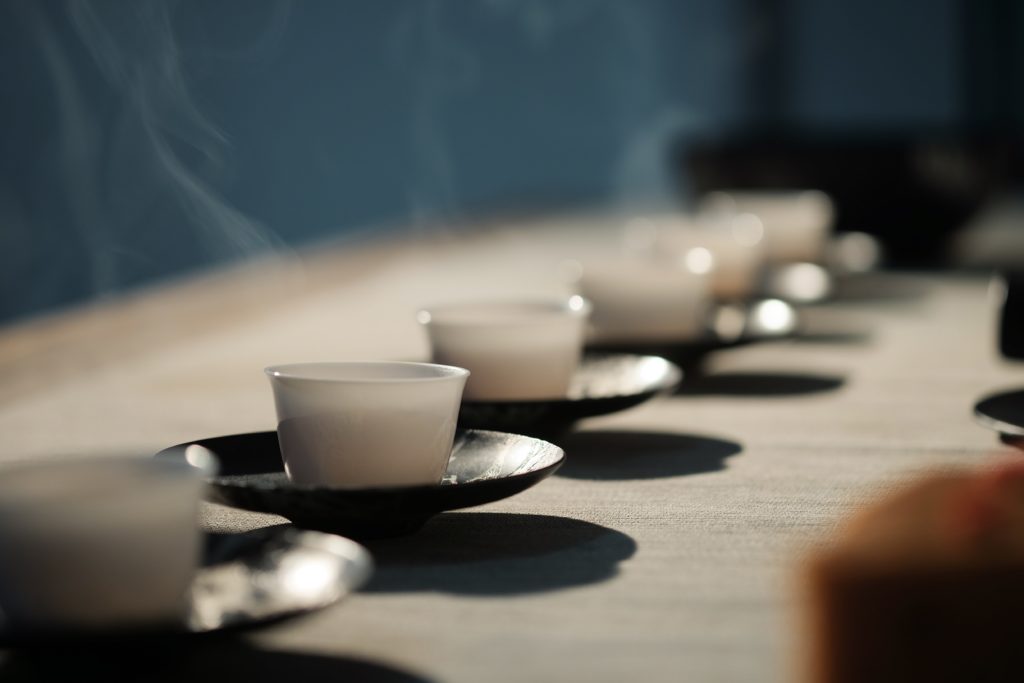 Gong fu tea service involves small cups like these, and small tea pots, and short brewing times.