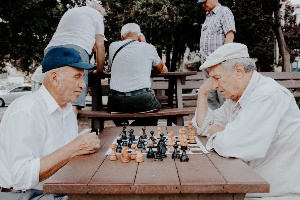 Elderly people playing chess